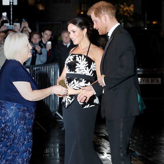 Prince Harry and Meghan Markle proudly show off baby bump on red carpet ...